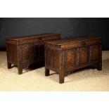 A Fine & Rare Pair of 17th Century Carved & Inlaid Oak Coffers: Each having an edge-moulded lid