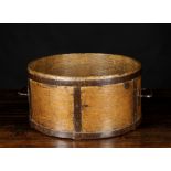 An Oak Bentwood Grain Measure bound in iron straps with a handle either side, 8½ ins (22 cms) high,