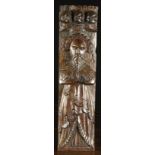 An Elizabethan Ornamental Oak Term carved in the form of a bearded gentleman wearing a layered robe