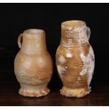 Two 15th Century Siegburg Jugs with ring turned bodies and crimped feet,