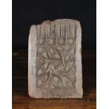 A 16th Century Oak Panel carved with tracery 14 ins x 9 ins (34 cm x 23 cms).