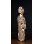 A 15th/16th Century Oak Carving of a Kneeling Saint, 17¾ ins (45 cms) in height.