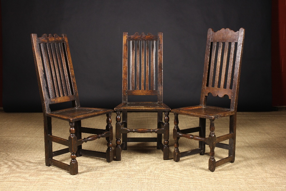 Three Early 18th Century Joined Oak Side Chairs: A pair and one single: all having a shaped