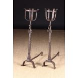 A Pair of 18th Century Wrought Iron Cresset topped Andirons.