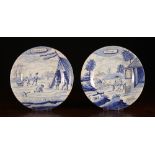 A Pair of 18th Century Blue & White Delft Plates painted with figural scenes: One depicting a