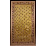 A Framed 18th or 19th Century Indian embroidered yellow silk panel worked in chain stitch with