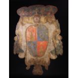 A Large 18th Century Italian Painted Wooden Armorial Shield, 58 ins x 42 ins (147 cm x 107 cms).