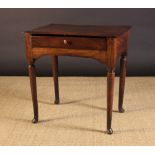 A Small 18th Century Elm Side Table having a single plank top with moulded edge above a frieze