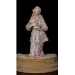 A 17th/18th Century Terracotta Figure of Mary Magdelene retaining traces of original polychrome