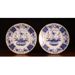 A Pair of Large 18th Century Blue & White Delft plates decorated with flowers and edged with yellow