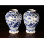 A Pair of 18th Century Blue & White Delft Vases with chinoiserie decoration in scalloped cartouches