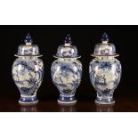 A Set of Three 18th Century Blue & White Delft Garniture Vases with Covers.