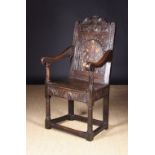 An Elizabethan Carved & Inlaid Oak Wainscot Chair, attributed to Exeter, Circa 1590-1600.
