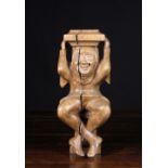 A 17th Century Netherlandish Carving; A figural support in the form  of a lively Court Jester,