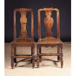 Two Queen Anne Period Side Chairs having a crested top rails above a shaped centre splats leading