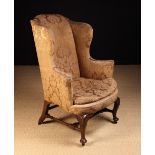 A George II Upholstered Walnut Armchair.