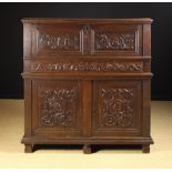 A Fine 16th Century Oak Secrètaire Cupboard with carved Renaissance panels depicting profile