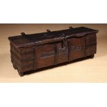 An Imposing Henry VIII Planked Oak Coffer constructed from thickly hewn timbers and bound in iron