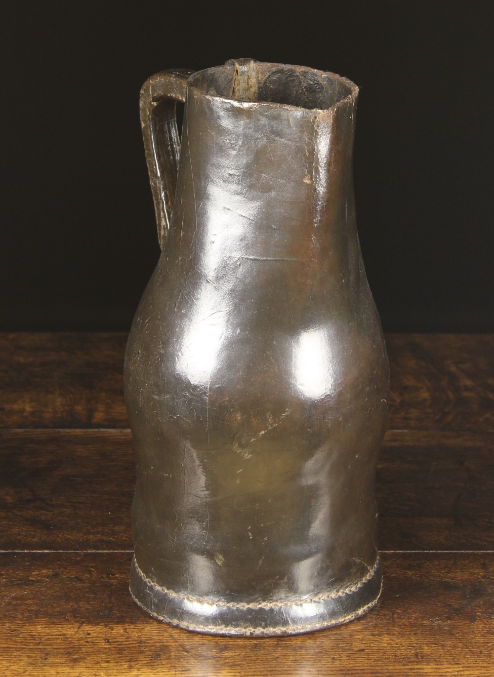 A Good Late 17th/Early 18th Century Leather Bombard, 14 ins (35.5 cms) in height.