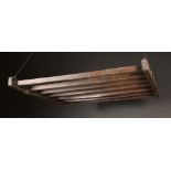 An Oak Ceiling Hanging Rack composed of seven long slats morticed through side rails,