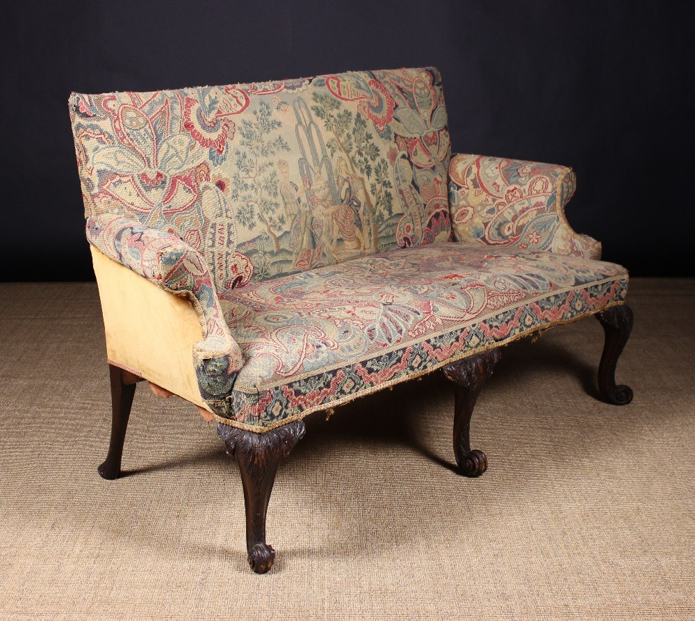 A Fine George II Style Carved Mahogany Settee, upholstered in needlework tapestry.