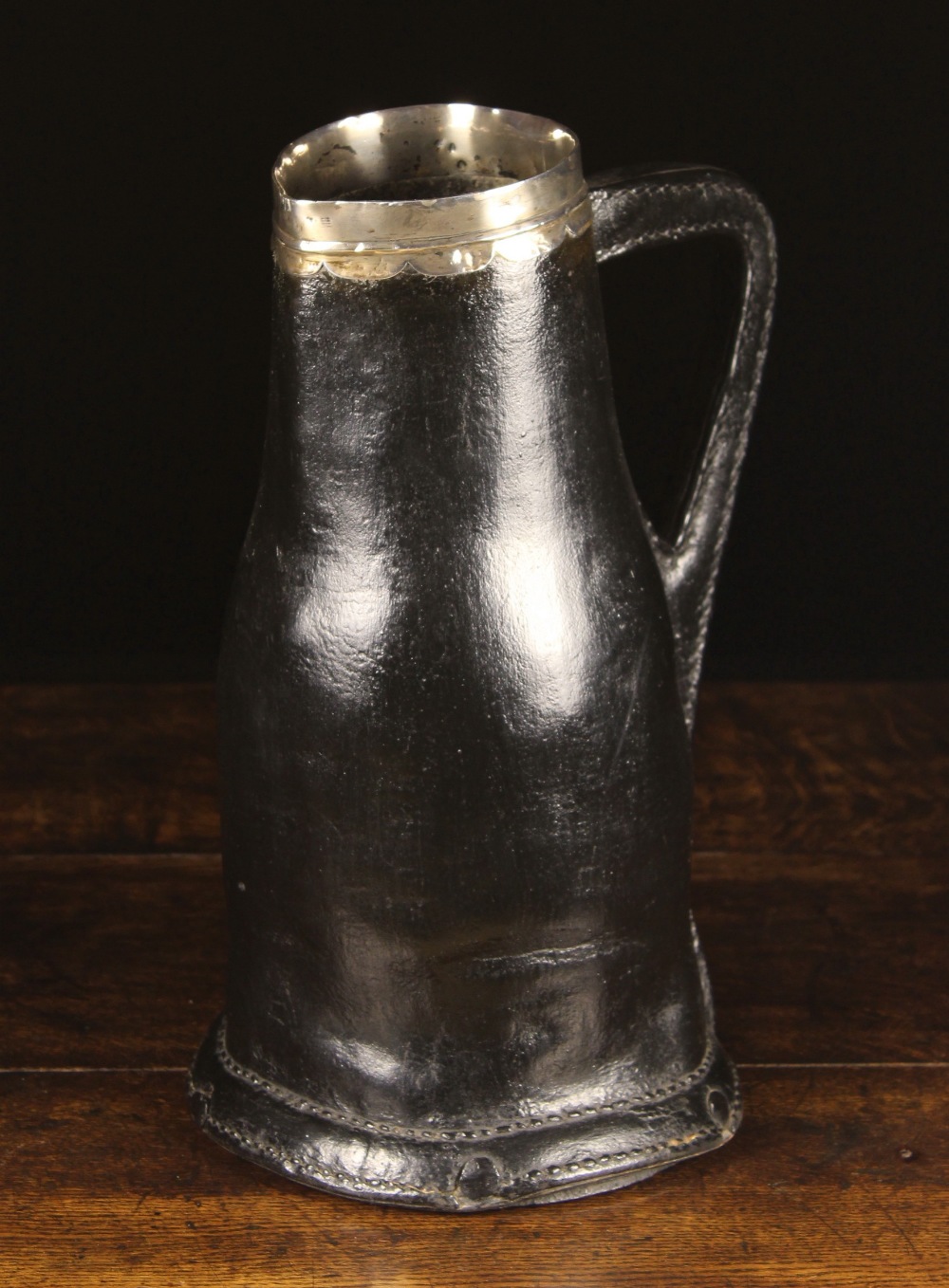 A Fine Late 17th Century Silver Mounted Leather Bombard.