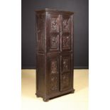 A Rare 16th Century Oak Marriage Cupboard of unusually slim proportions,