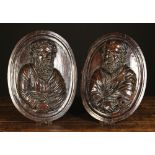 A Pair of 17th Century Relief Carvings depicting the busts of Saint Peter with key and Saint Paul