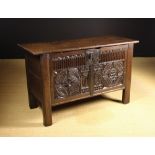A Large 16th Century Oak Coffer enriched with chip carving.