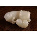 A 19th Century Jade Carving of a Cat and Kitten; celadon with russet inclusions,