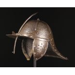 A 17th Century Lobster-tailed Helmet with sliding nasal bar piercing throught the fixed peak,