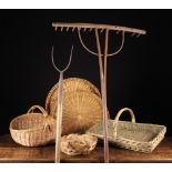 An Old Pitch Fork, A Hay Rake and Five Wicker Baskets: The pitch fork on an ash pole handle,