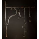 A Large 18th Century Wrought Iron Chimney Crane with one movement 50 ins (127 cms) high,