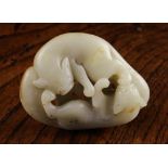 A 19th Century Chinese Jade Pebble Carving of two foxes playing,