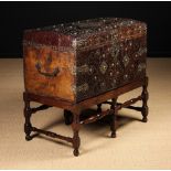 A Fabulous 17th Century English Leather-clad Dome-topped Chest adorned with decorative brass