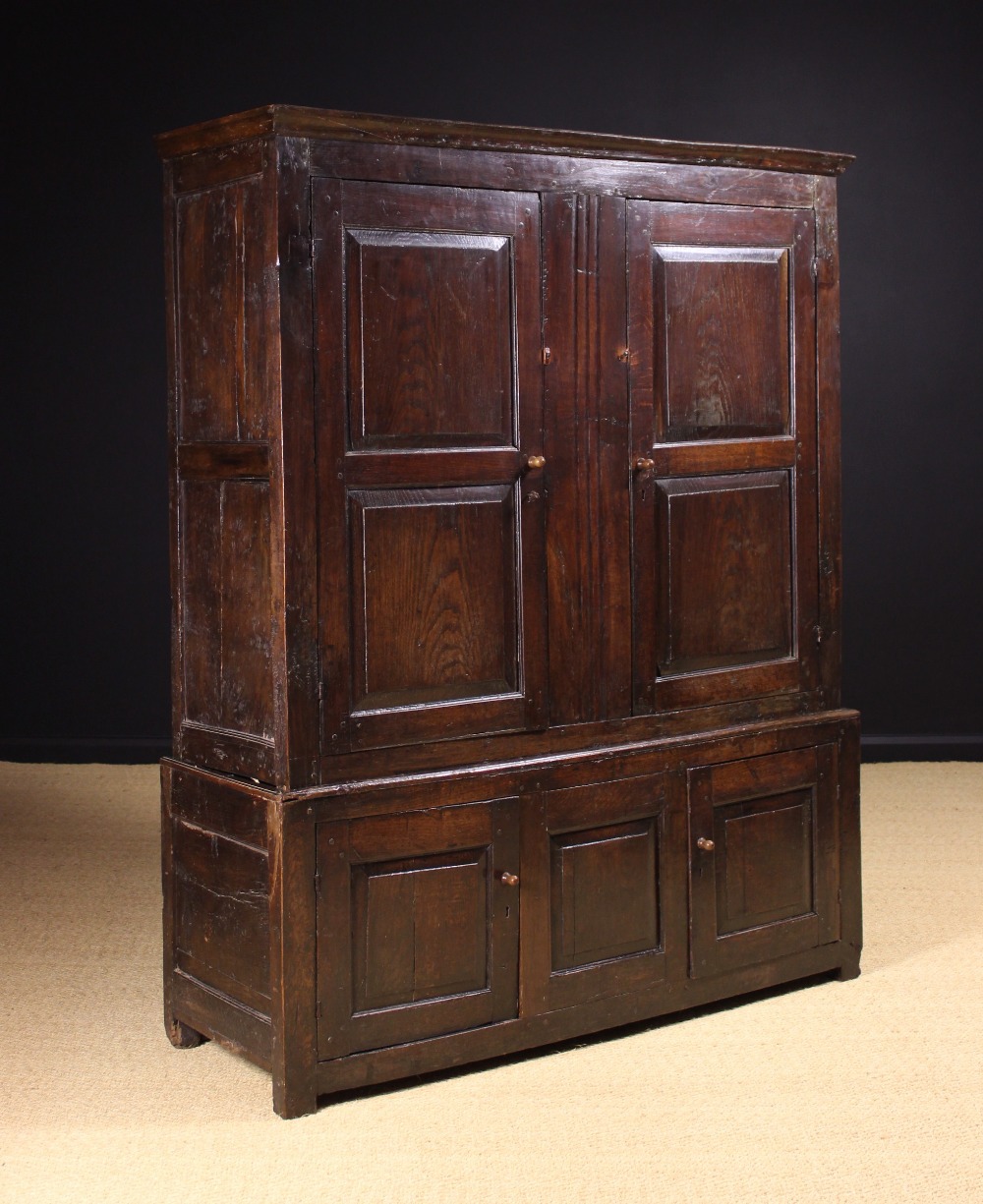 An 18th Century Joined Oak Press Cupboard in two sections.