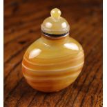 A Striated Agate Snuff Bottle with finialed dome stopper, 2½ ins (6.4 cms) in height.
