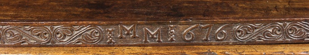 A Long 17th Century Carved Oak Rail decorated with a band of foliate S-scrolls with strap-work