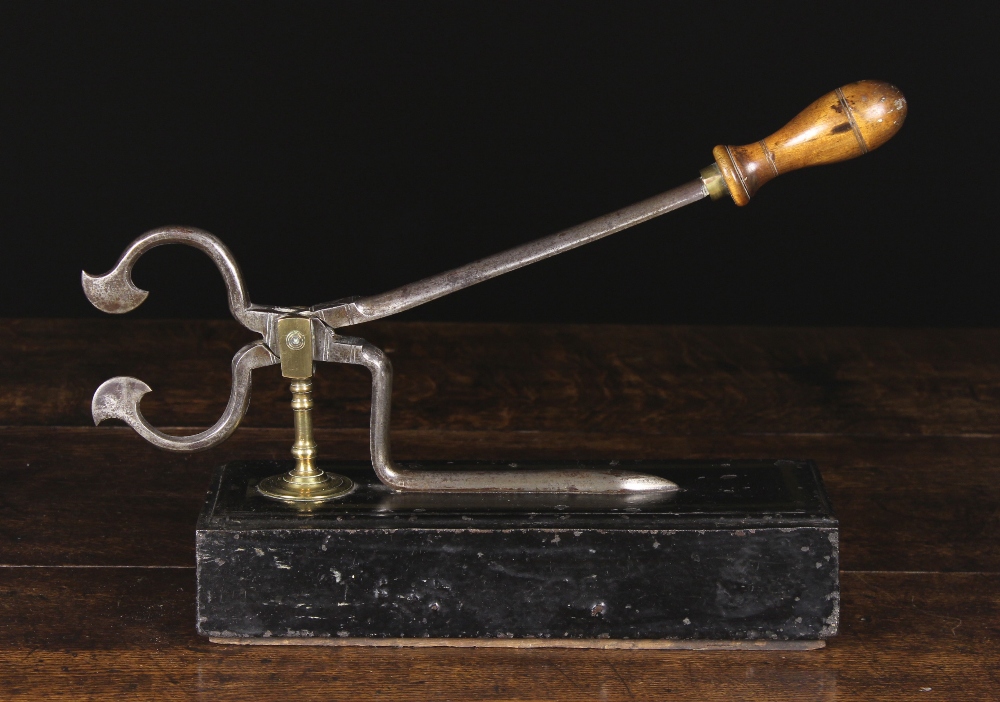 A Fine 18th Century Steel Sugar Cutter with turned wooden handle and brass mount,