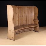 A 19th Century Stripped Pine Barrel-Backed Settle.