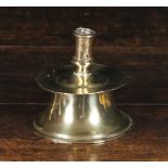 A 16th Century Capstan Candlestick, 4½ ins (11.5 cms) high.