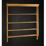 A Set of Pine Hanging Wall Shelves with a moulded top over open backed shelves,