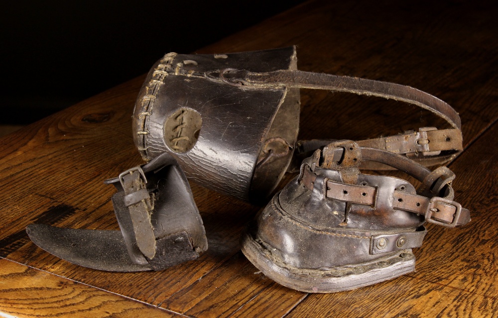 A Leather & Iron Hoof Boot, a Leather Horse's Muzzle and an Iron & Leather Stirrup.