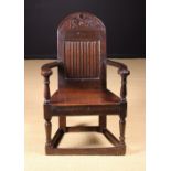 A Fine Mid 17th Century Joined Oak Caqueteuse Armchair of good, rich colour and patination.