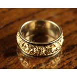 A Fine Quality Georgian Mourning Ring embossed & chased with a band of flowers & foliage edged in