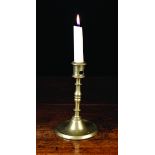 A Brass Candlestick.