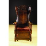 A Charming Early 18th Century Joined Oak Wing Armchair of fine colour and patination.