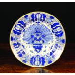 A Late 18th/Early 19th Century Blue & White Delft Plate decorated with an urn of fanned peacock