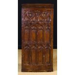 A Walnut Pew-end of rectangular form carved with Gothic tracery arches 38 ins x 17½ ins (96 cm x 44