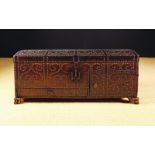 A Late 17th/Early 18th Century Fitted Leather Clad Chest adorned with brass studs and standing on